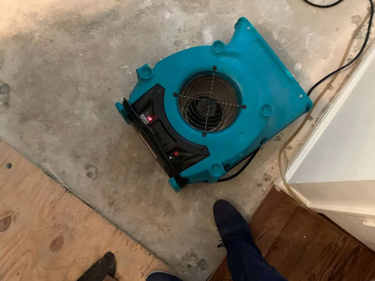 Air mover drying subfloor during Commercial Water Damage Restoration in Pompano Beach